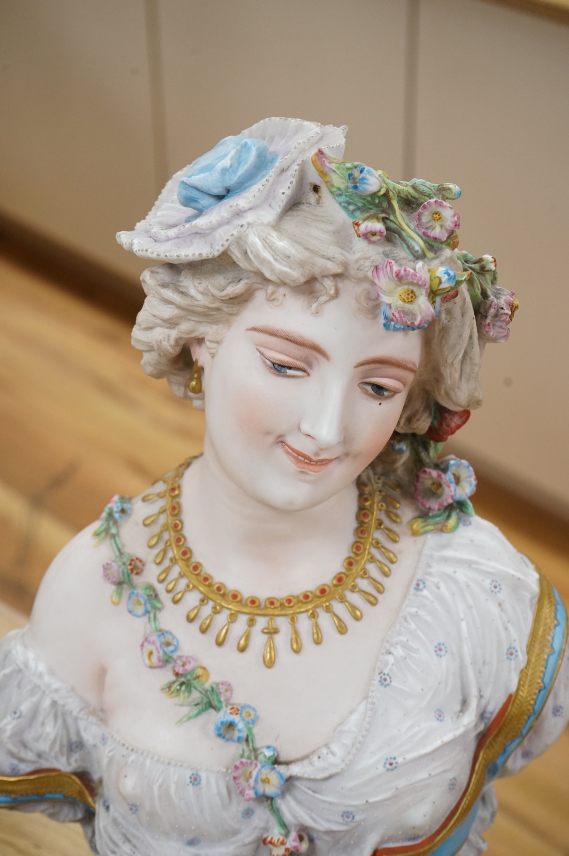 A Paris painted biscuit porcelain bust of a woman, stamped L&M, 50cm